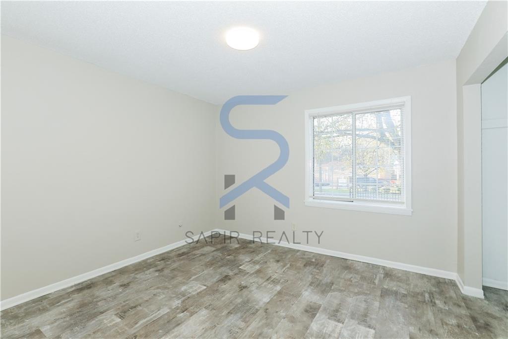 2055 Alison Court Southwest, Unit 3 Atlanta, GA 30311 - Photo 6 of 12 an empty room with windows