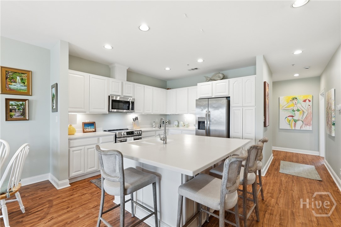 214 Butler Avenue, Unit 306 Tybee Island, GA 31328 - Photo 12 of 49 Kitchen Island perfect for entertaining!