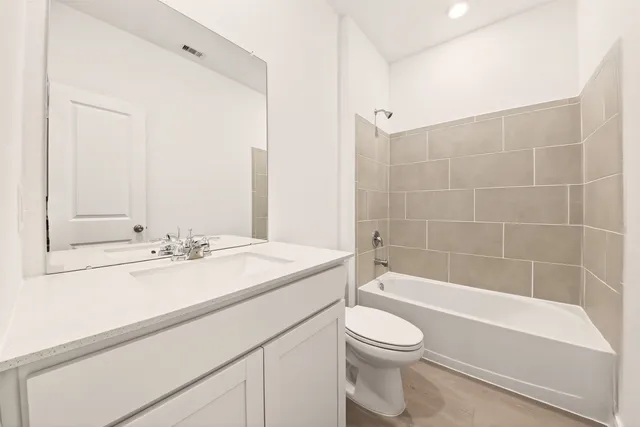 a bathroom with a sink a toilet and a bathtub