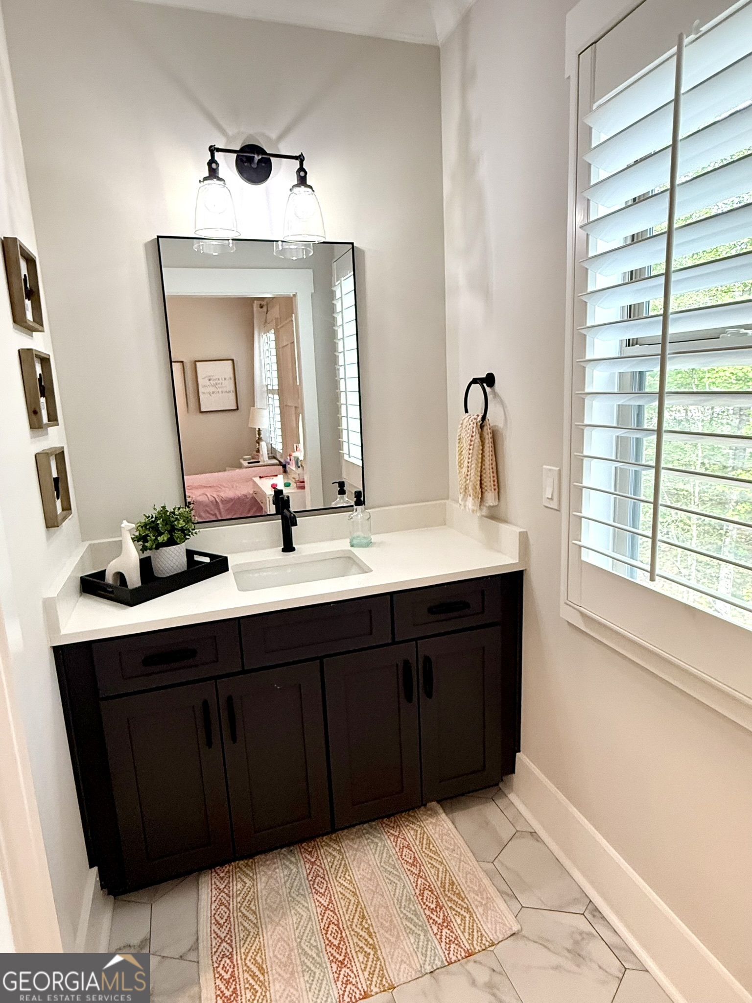 120 Spring Creek Drive Rutledge, GA 30663 - Photo 29 of 38 a bathroom with a double vanity sink and a mirror