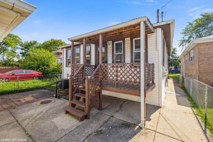 5408 South Rutherford Avenue Chicago, IL 60638 - Photo 15 of 15 a front view of a house with a yard