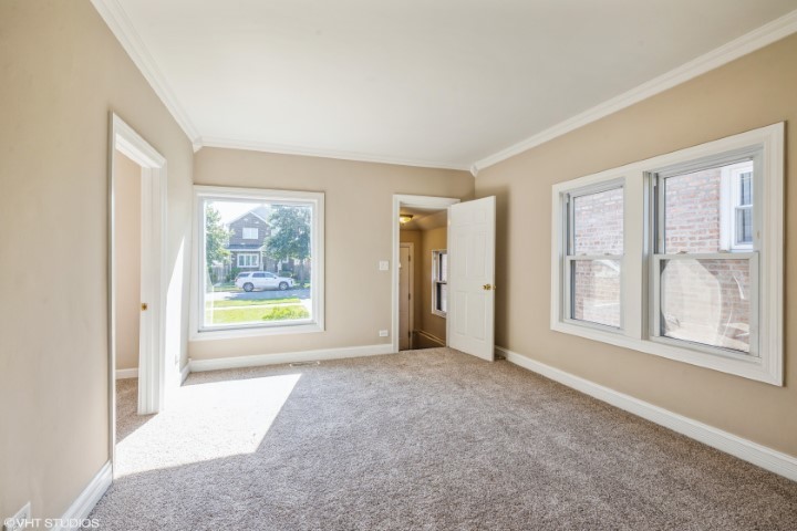 5408 South Rutherford Avenue Chicago, IL 60638 - Photo 2 of 15 a view of an empty room and a window
