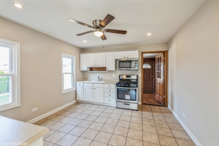 5408 South Rutherford Avenue Chicago, IL 60638 - Photo 5 of 15 a kitchen with stainless steel appliances a refrigerator and microwave