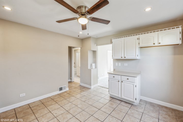 5408 South Rutherford Avenue Chicago, IL 60638 - Photo 7 of 15 a view of a kitchen with a sink and cabinets
