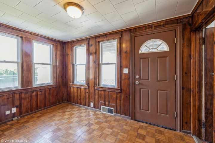 5408 South Rutherford Avenue Chicago, IL 60638 - Photo 8 of 15 wooden floor in an empty room with a window