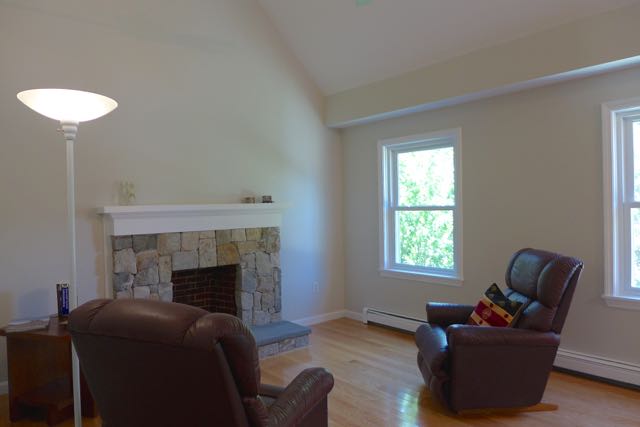 75 Dodgers Hole Road Edgartown, MA 02539 - Photo 7 of 18 New, stone-faced fireplace and mantel - and all freshly paintd. Note hardwood throughout.