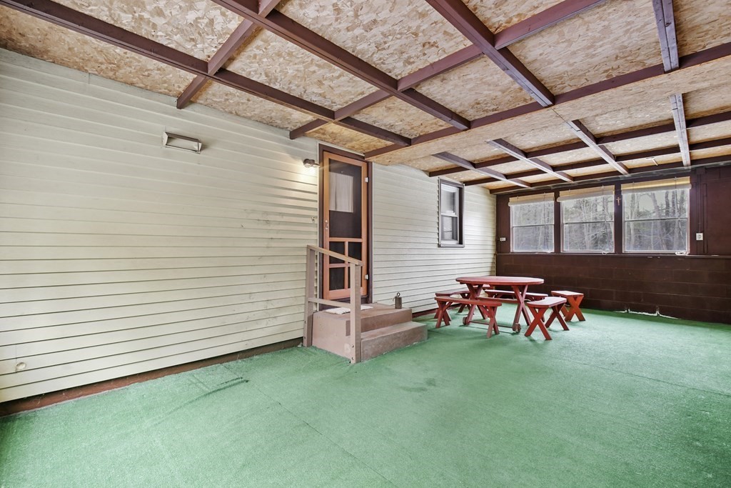 179 State Road Templeton, MA 01436 - Photo 3 of 22 a backyard of a house with chairs and wooden fence