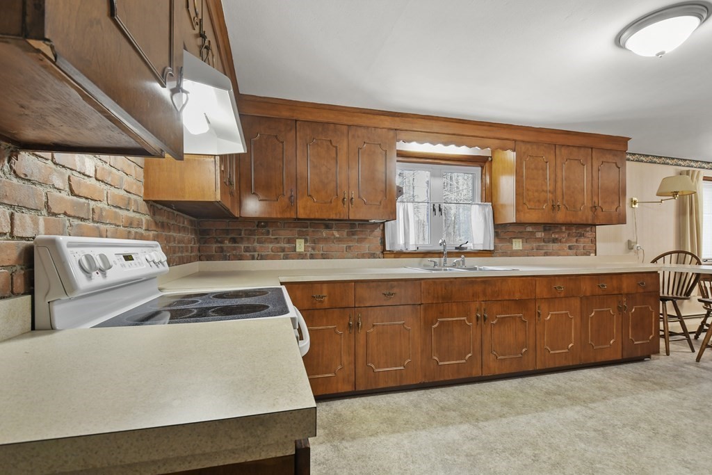 179 State Road Templeton, MA 01436 - Photo 6 of 22 a kitchen with stainless steel appliances a stove a sink a stove and a microwave