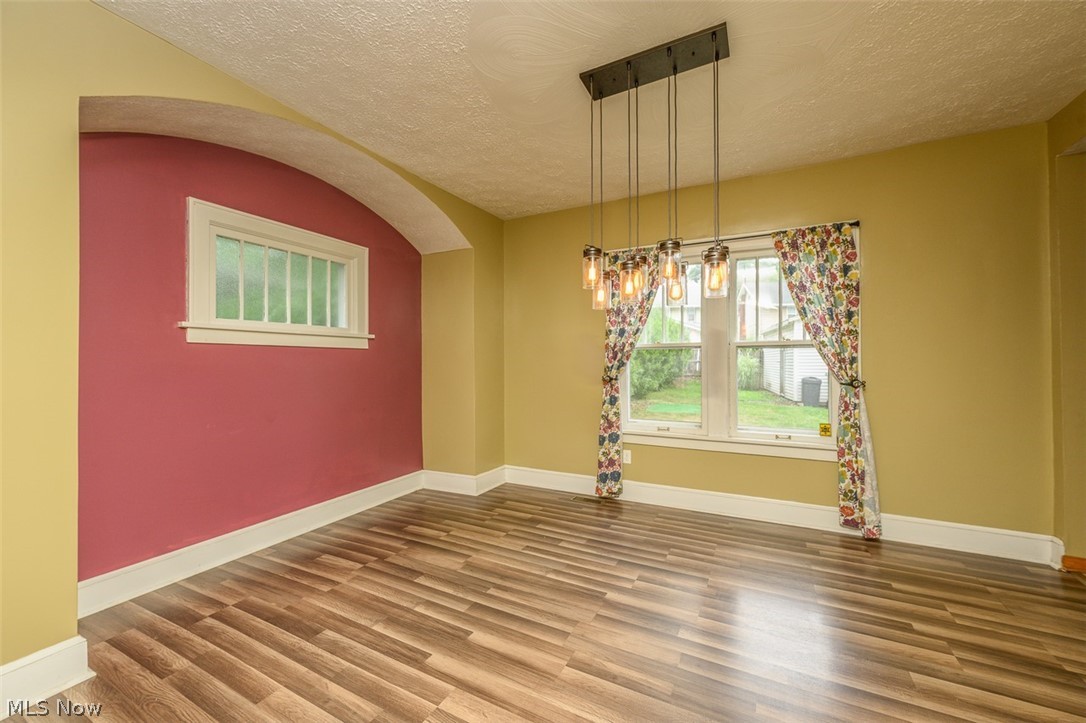 1222 Ridge Road Northwest Canton, OH 44703 - Photo 14 of 32 Dining room with vinyl flooring and hanging light
