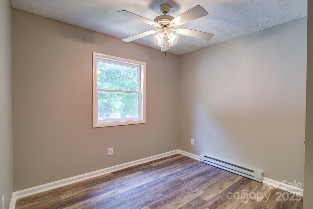 573 Margot Road Boone, NC 28607 - Photo 7 of 15 wooden floor in an empty room with a window