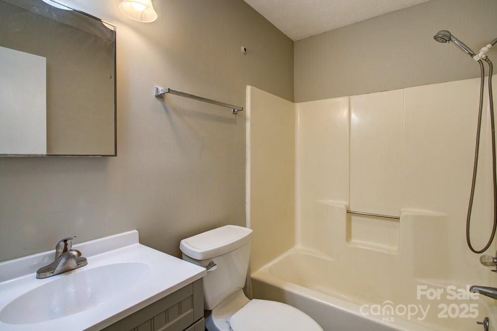 573 Margot Road Boone, NC 28607 - Photo 8 of 15 a bathroom with a sink a toilet and shower