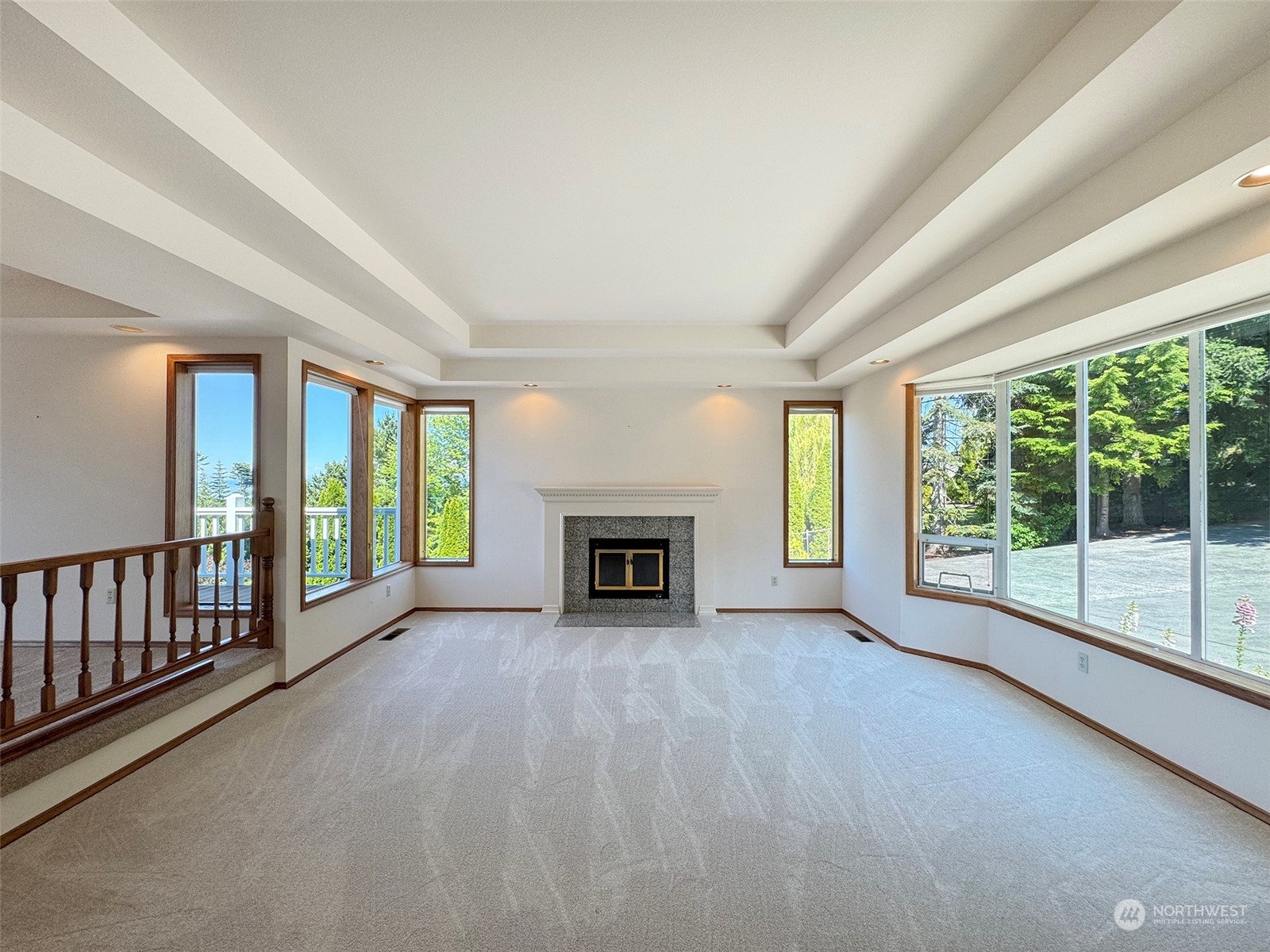 423 Ravens Ridge Road Sequim, WA 98382 - Photo 8 of 39 a view of an empty room with a fireplace and a window