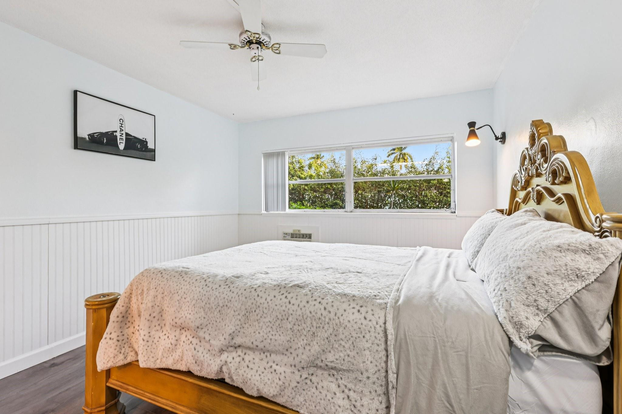 2131 Northeast 42nd Court, Unit 106E Lighthouse Point, FL 33064 - Photo 19 of 33 a bedroom with a bed and a window