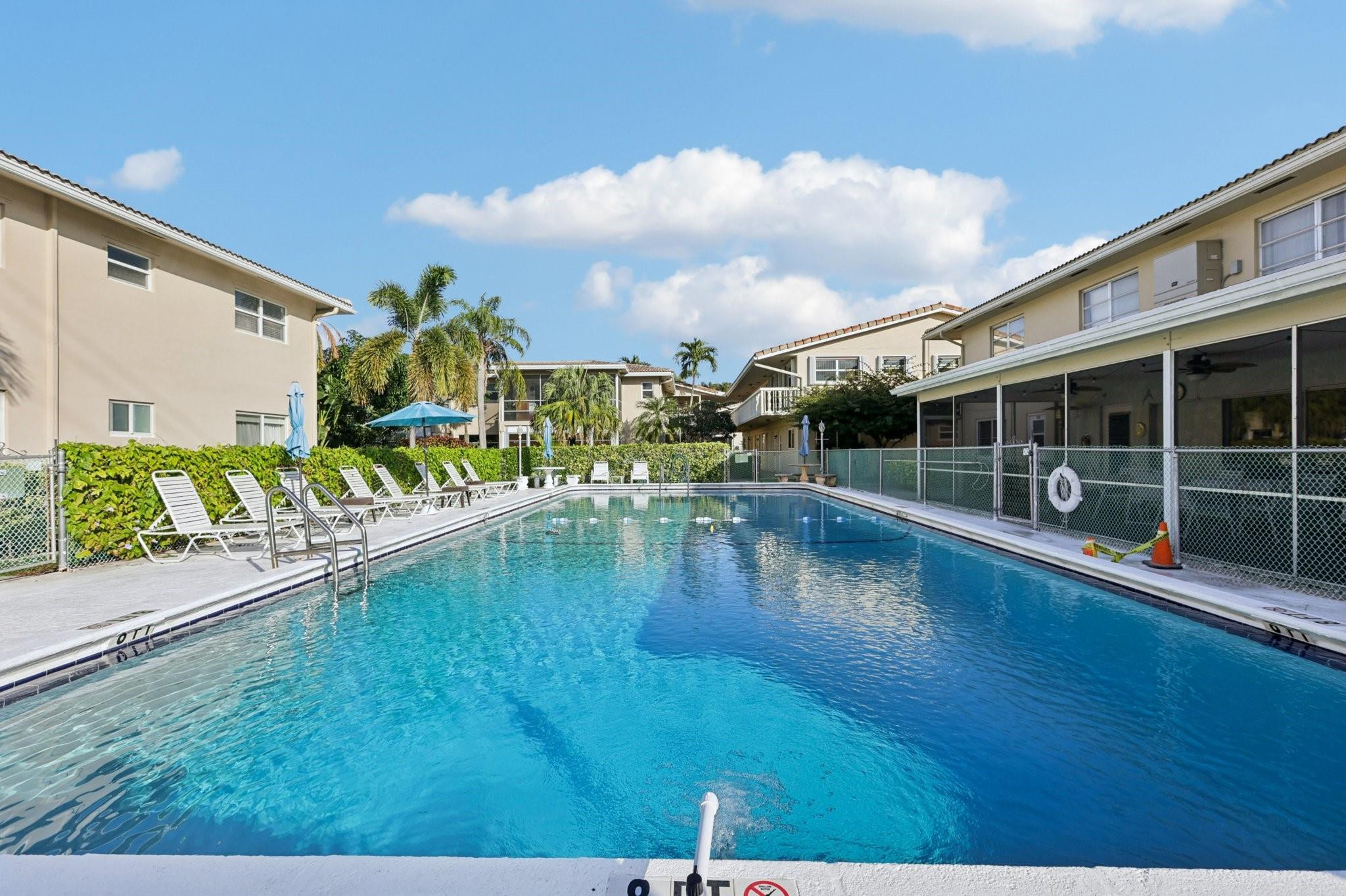 2131 Northeast 42nd Court, Unit 106E Lighthouse Point, FL 33064 - Photo 31 of 33 a view of swimming pool with outdoor seating