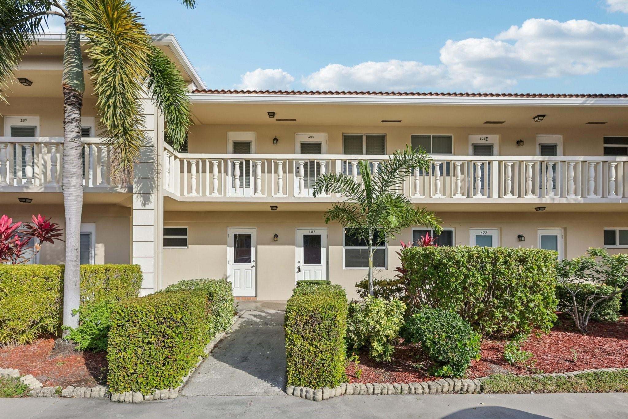 2131 Northeast 42nd Court, Unit 106E Lighthouse Point, FL 33064 - Photo 32 of 33 front view of a house