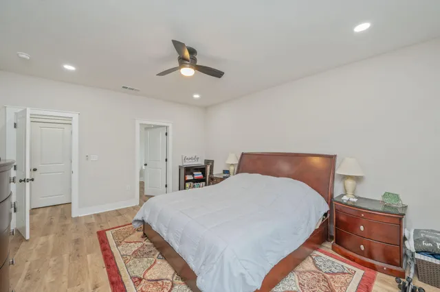 a bed room with a bed and a chandelier
