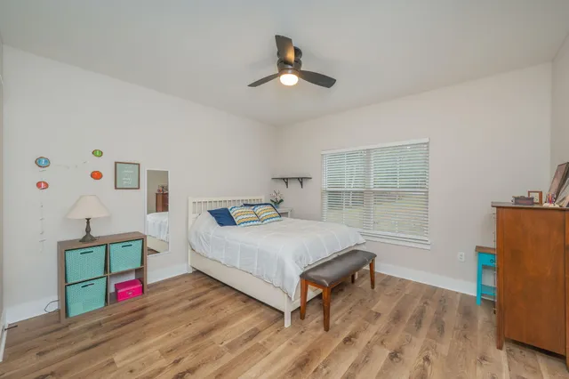 a bed room with a bed and a window