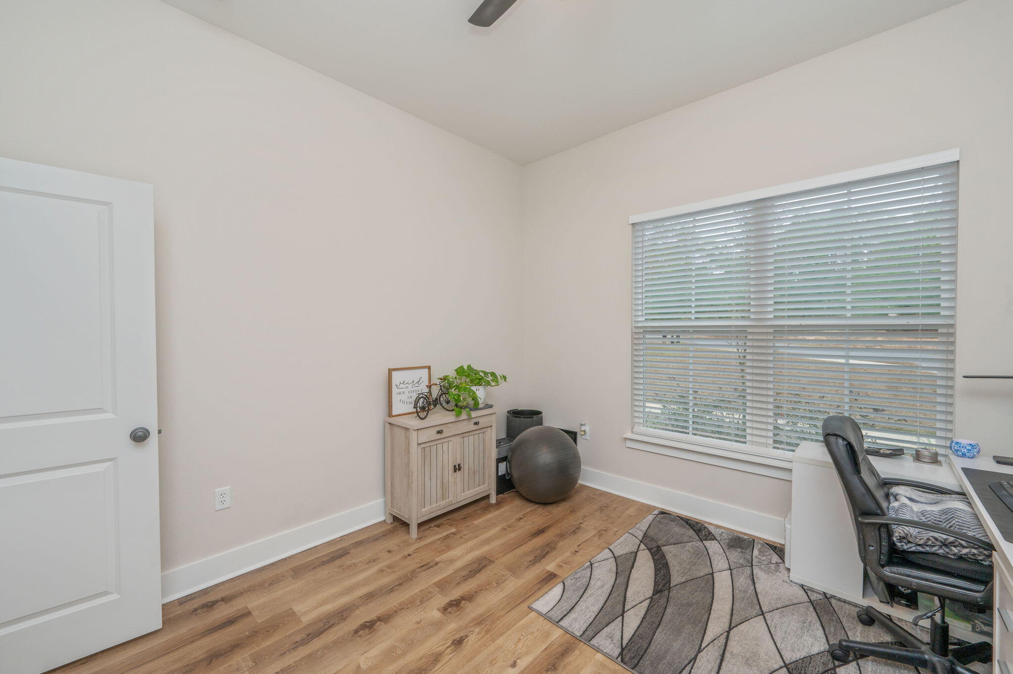 280 Timberline Drive Crestview, FL 32539 - Photo 28 of 46 a bedroom with a bed and wooden floor