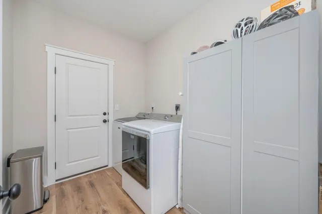 a utility room with washer and dryer