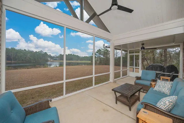 a living room with couch guitar and outer view