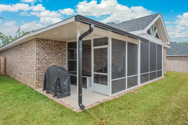 a backyard of a house with plants and garden