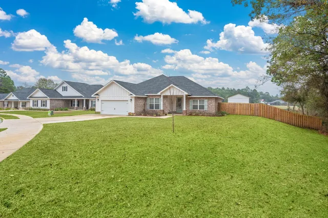 a view of a house with a big yard