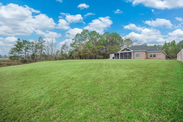 a view of a house with a big yard