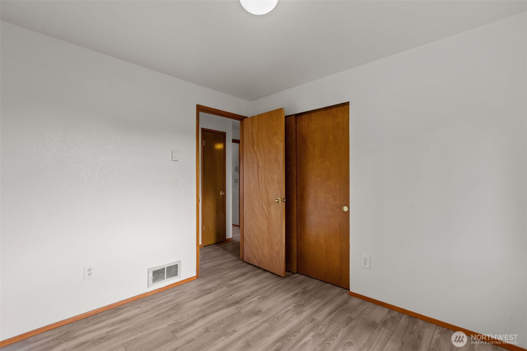 224 7th Street Gold Bar, WA 98251 - Photo 16 of 35 a view of an empty room with wooden floor