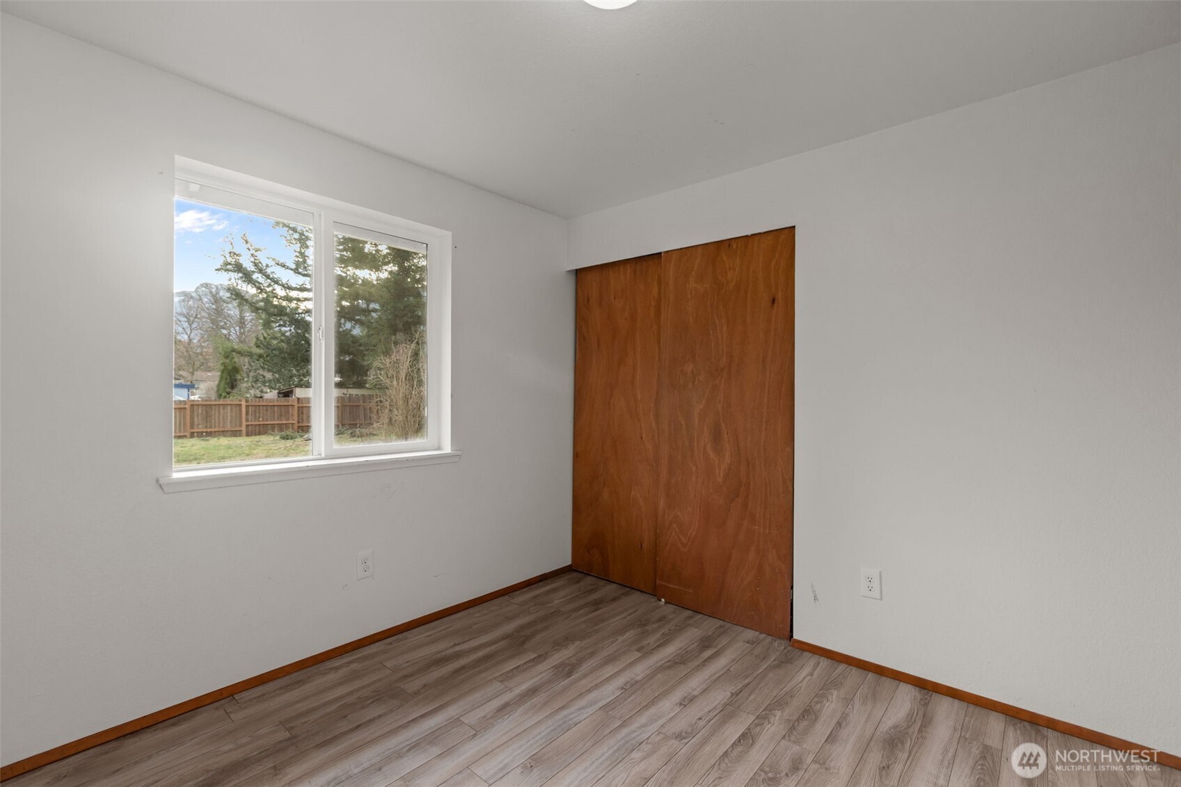 224 7th Street Gold Bar, WA 98251 - Photo 20 of 35 an empty room with wooden floor and windows