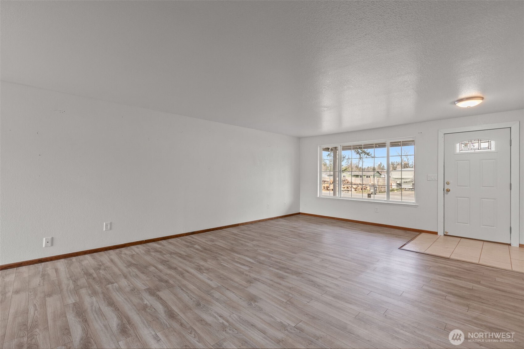 224 7th Street Gold Bar, WA 98251 - Photo 3 of 35 a view of an empty room and wooden floor