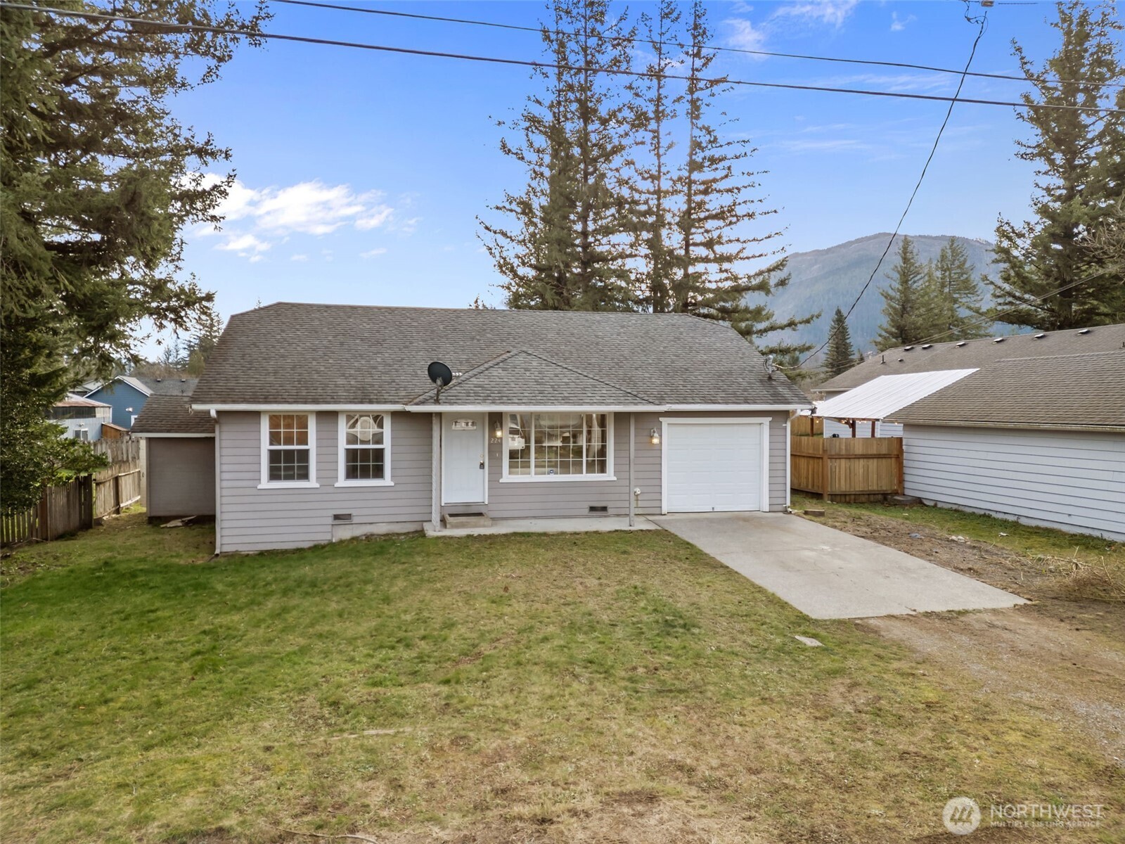 224 7th Street Gold Bar, WA 98251 - Photo 35 of 35 a view of a house with a big yard and large tree