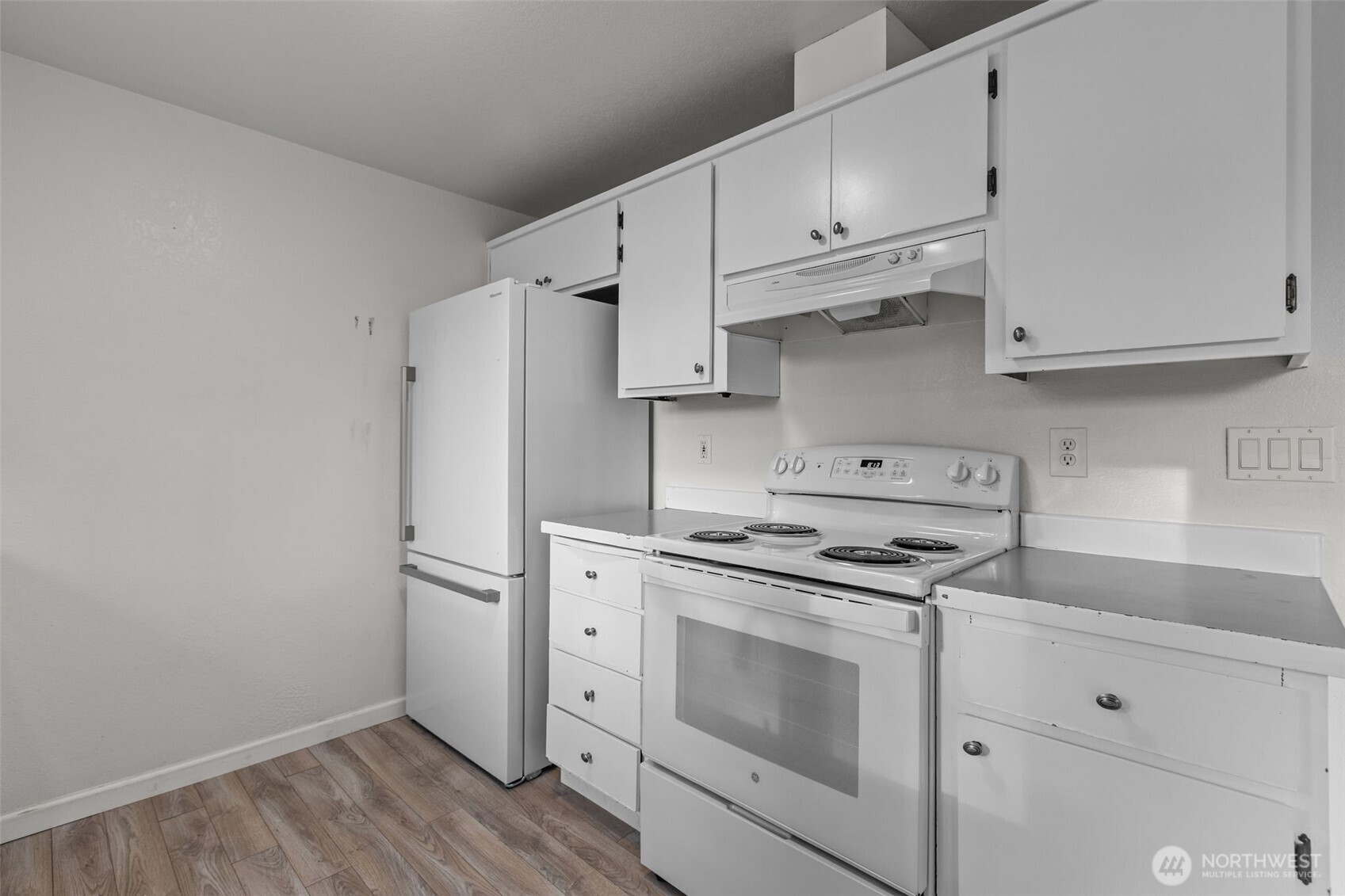 224 7th Street Gold Bar, WA 98251 - Photo 10 of 35 a kitchen with cabinets appliances and wooden floor