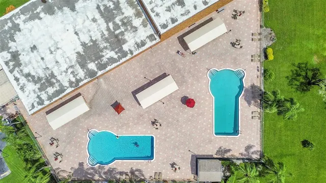 with aerial view of a house with a backyard space