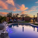 an aerial view of a house with garden space and patio