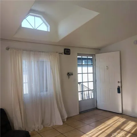 a view of an empty room and window