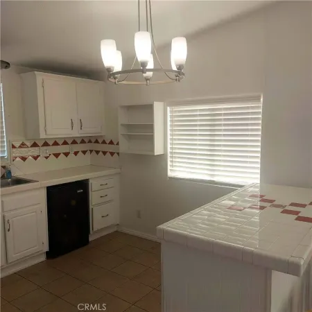 a bathroom with a sink vanity and a mirror