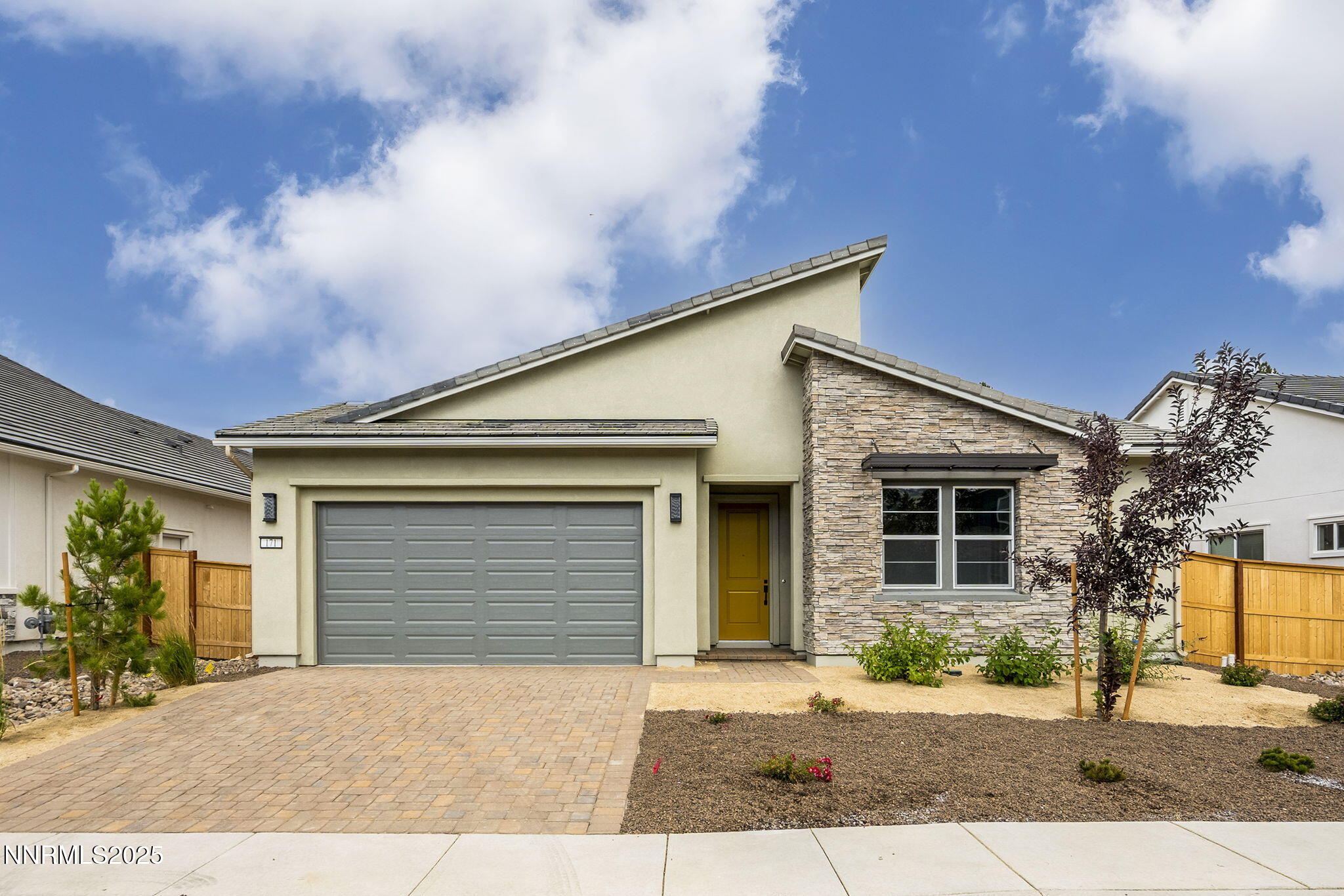 171 Commodore Drive, Unit LOT 325 Verdi, NV 89439 - Photo 1 of 28 a front view of a house with a yard and garage