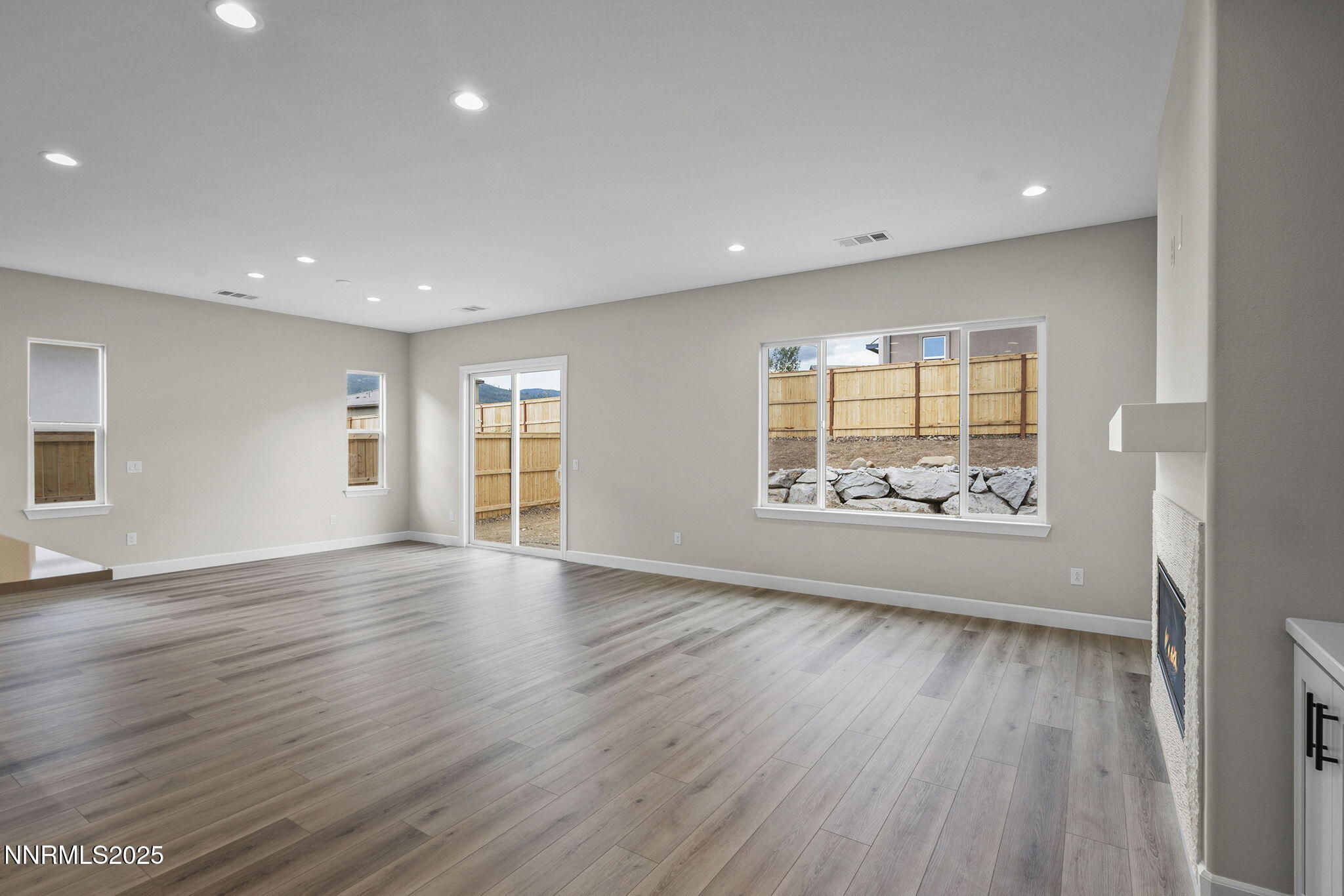 171 Commodore Drive, Unit LOT 325 Verdi, NV 89439 - Photo 14 of 28 an empty room with wooden floor and windows