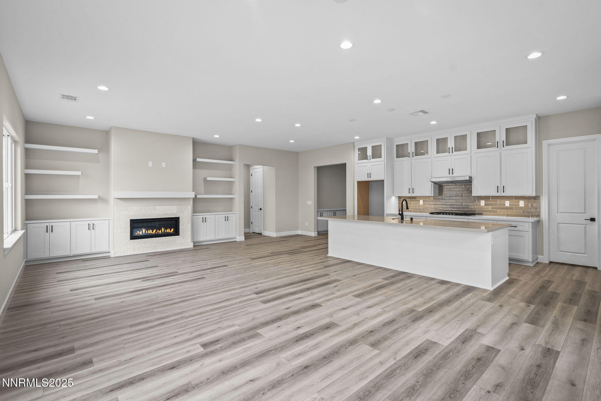171 Commodore Drive, Unit LOT 325 Verdi, NV 89439 - Photo 15 of 28 a large kitchen with kitchen island a sink wooden floor and a refrigerator