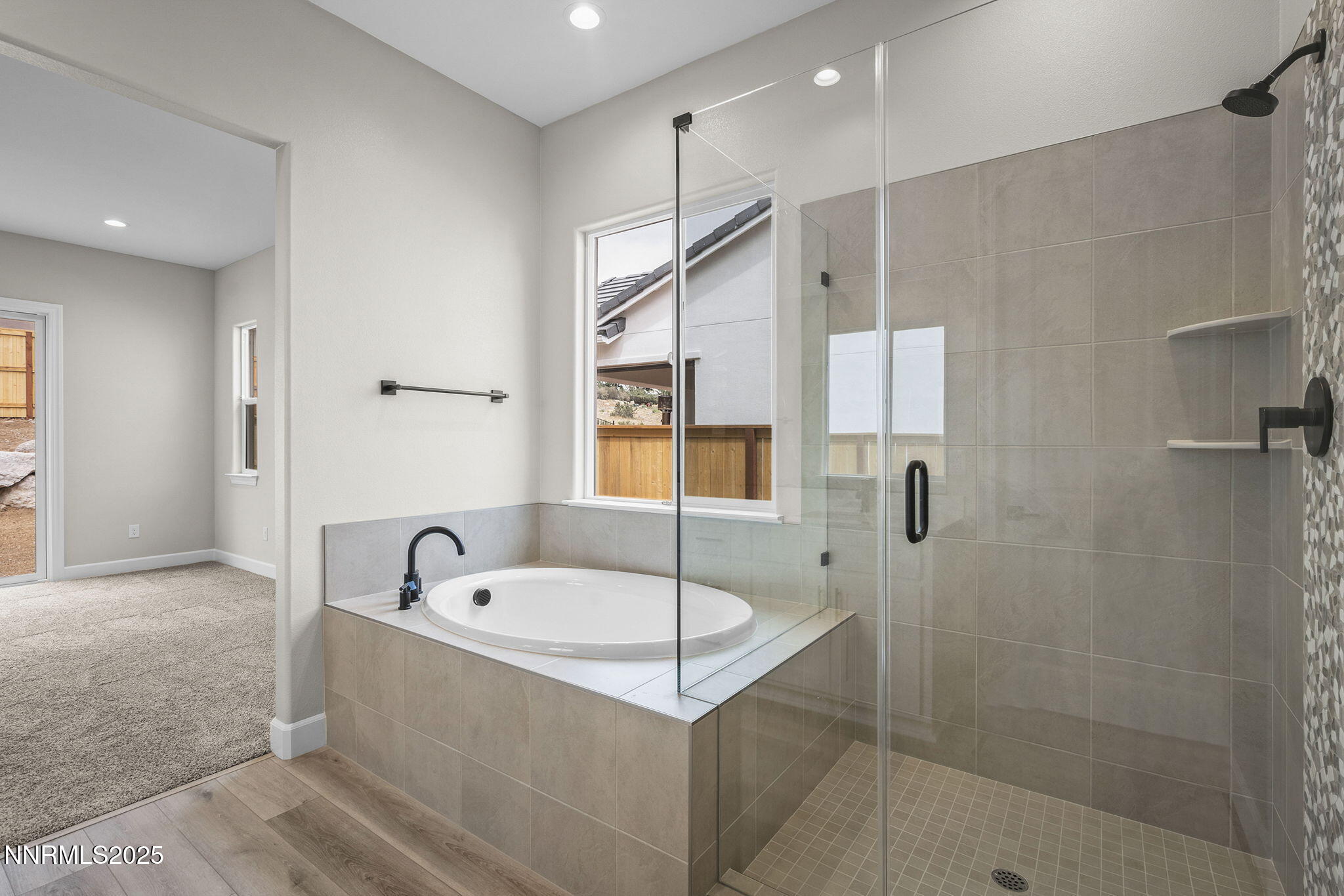 171 Commodore Drive, Unit LOT 325 Verdi, NV 89439 - Photo 19 of 28 a bathroom with a tub a window and a shower