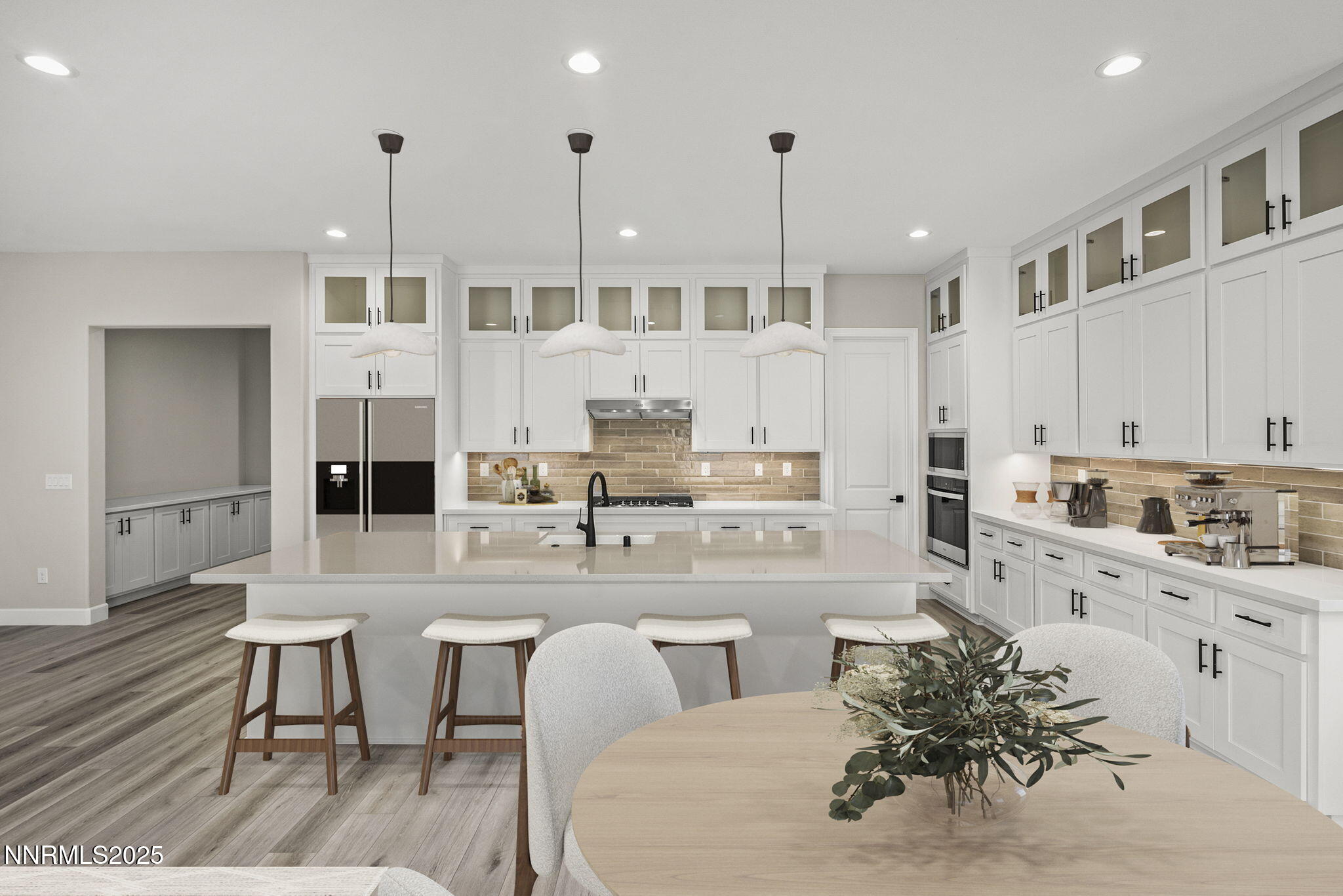 171 Commodore Drive, Unit LOT 325 Verdi, NV 89439 - Photo 3 of 28 a large white kitchen with stainless steel appliances kitchen island granite countertop a stove a sink a refrigerator and white cabinets