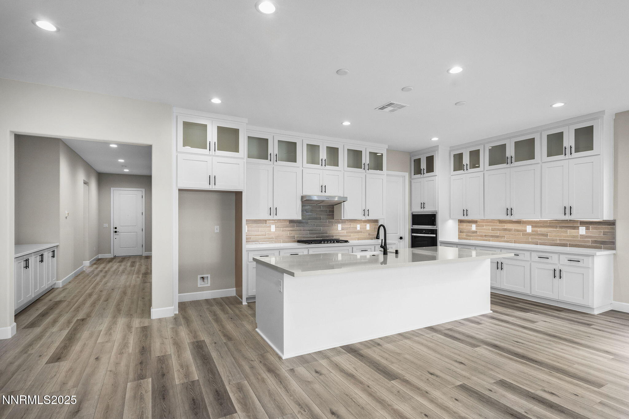 171 Commodore Drive, Unit LOT 325 Verdi, NV 89439 - Photo 6 of 28 a large white kitchen with a white countertops a stove a sink and a refrigerator