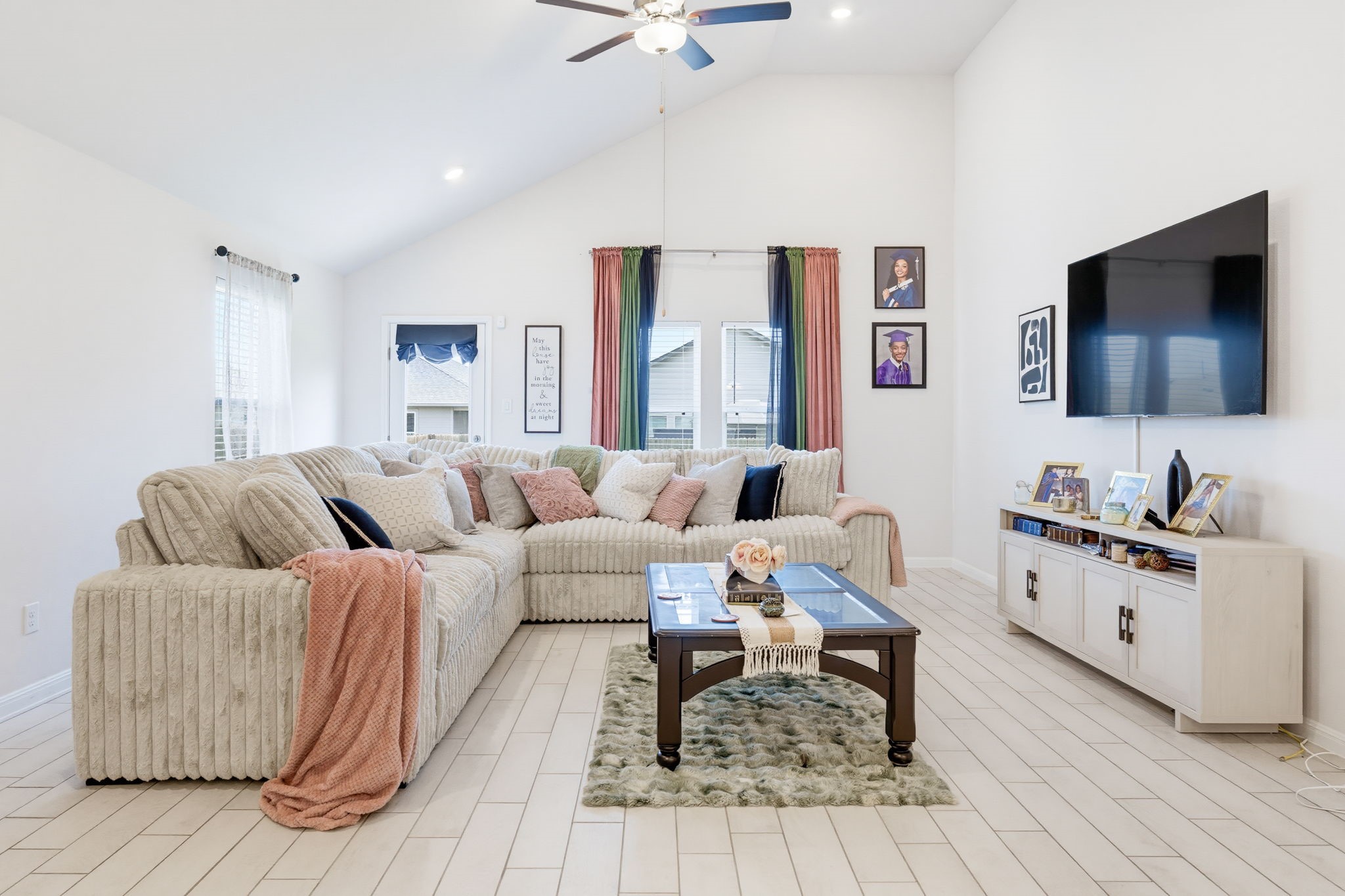316 Windstar Road Liberty Hill, TX 78642 - Photo 11 of 27 a living room with furniture and a flat screen tv