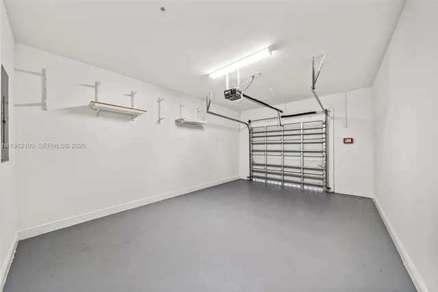 a view of a kitchen with storage and utility room