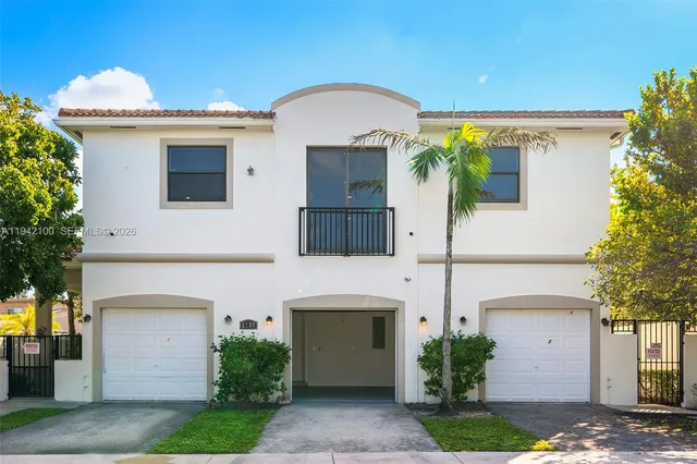 a front view of a house with a garage