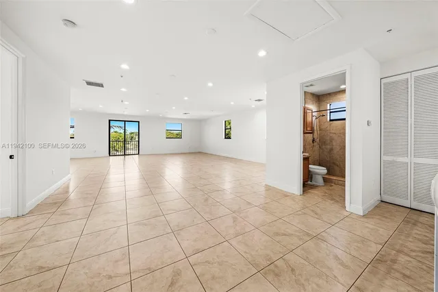 a view of an empty room and window