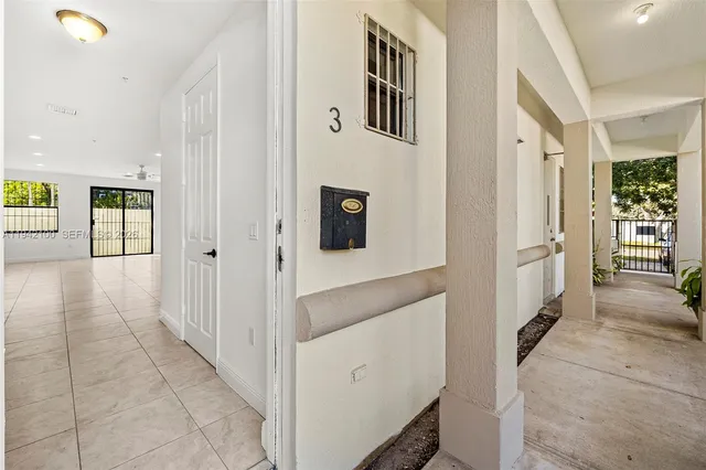 a view of a hallway with dining area