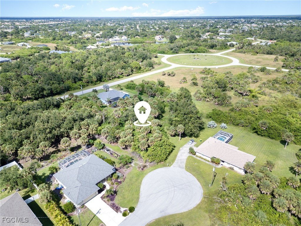 254 Spring Drive Rotonda West, FL 33947 - Photo 13 of 13 an aerial view of a house with a yard