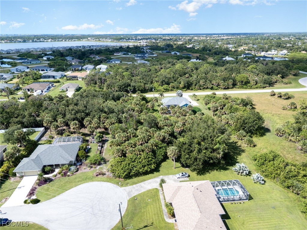 254 Spring Drive Rotonda West, FL 33947 - Photo 6 of 13 an aerial view of residential houses with outdoor space and ocean view