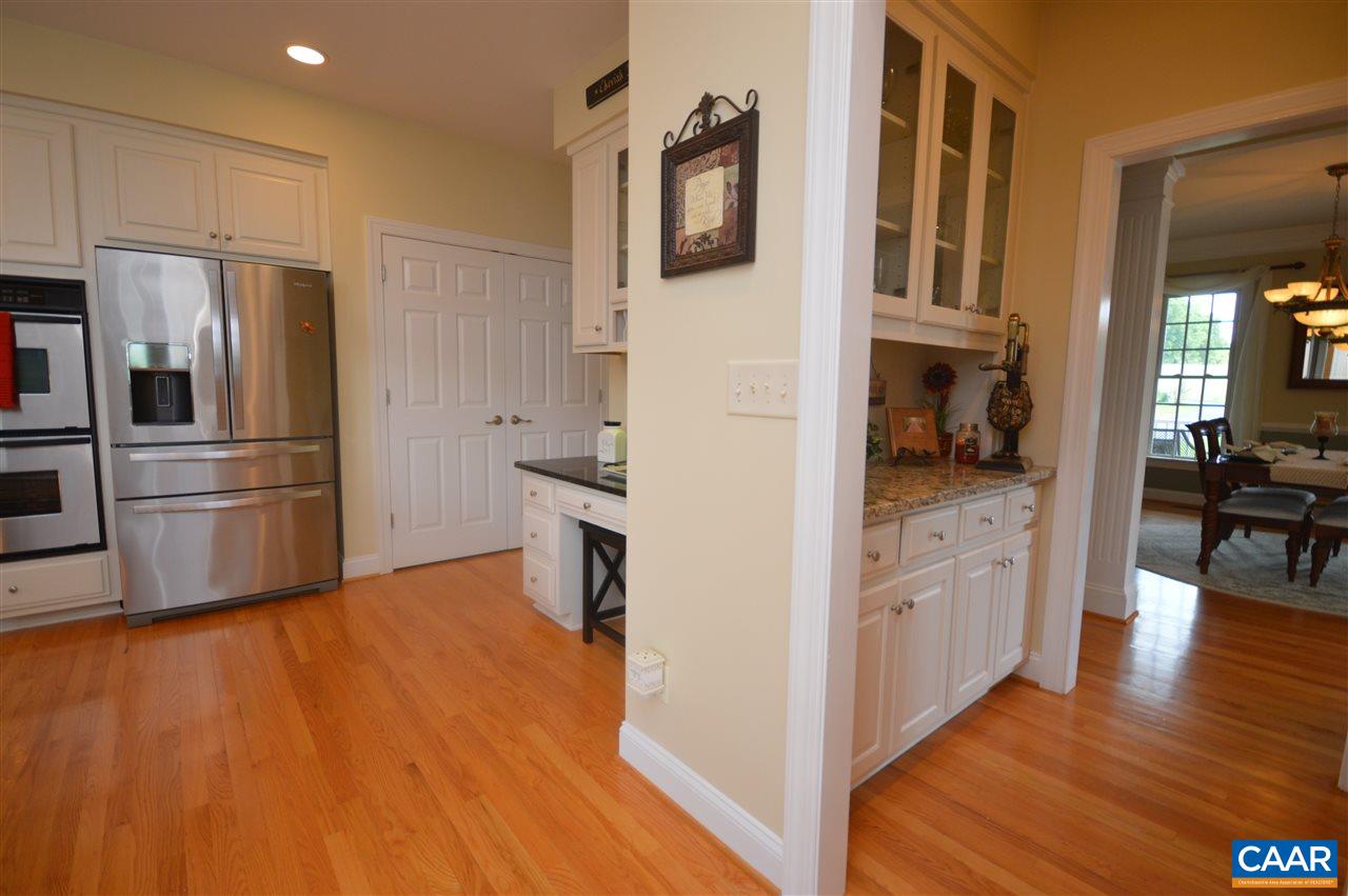 401 Sam Durrer Road Ruckersville, VA 22968 - Photo 16 of 50 a kitchen with stainless steel appliances a refrigerator and a stove top oven